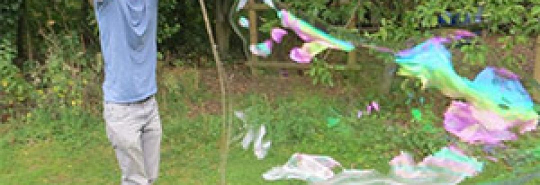 Man making giant bubbles