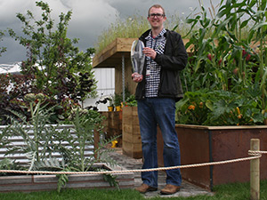 Owen Morgan of Mosaic Design with the BBC Gardeners' World Live trophy