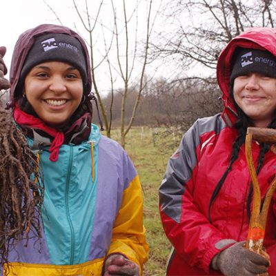 Two people planting trees as part of the I Dig Trees programme