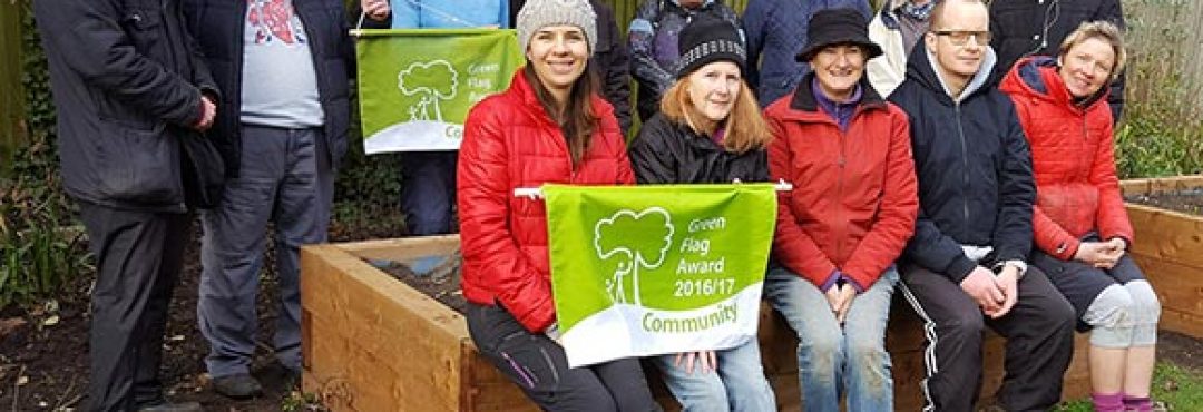 Members of Penge Green Gym with their Green Flag Award pennants