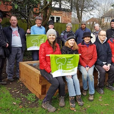 Members of Penge Green Gym with their Green Flag Award pennants