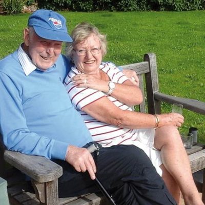 Two people sitting on a bench