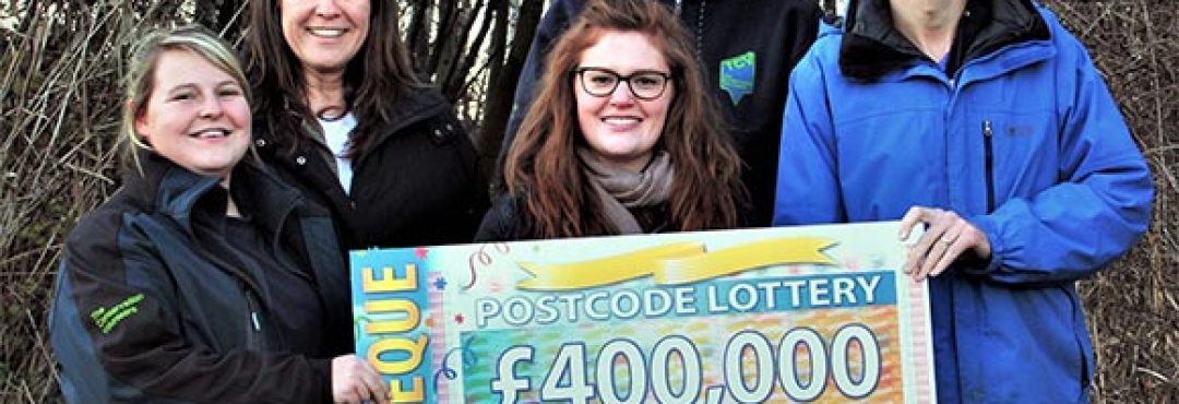 People from TCV receiving the Peoples' Postcode Lottery cheque