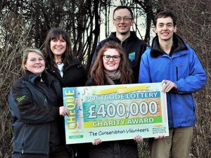 People from TCV receiving the Peoples' Postcode Lottery cheque