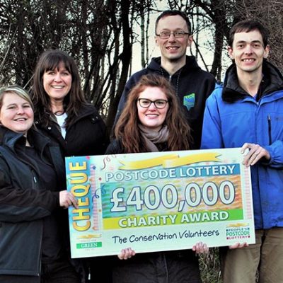 People from TCV receiving the Peoples' Postcode Lottery cheque