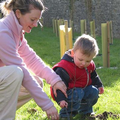 Mother and child planting trees