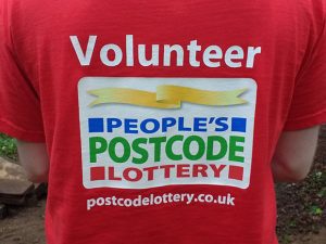A person wearing a red t-shirt