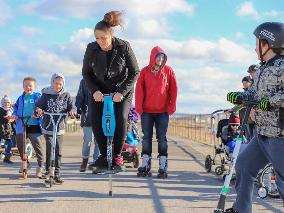 People enjoying the outdoors on scooters