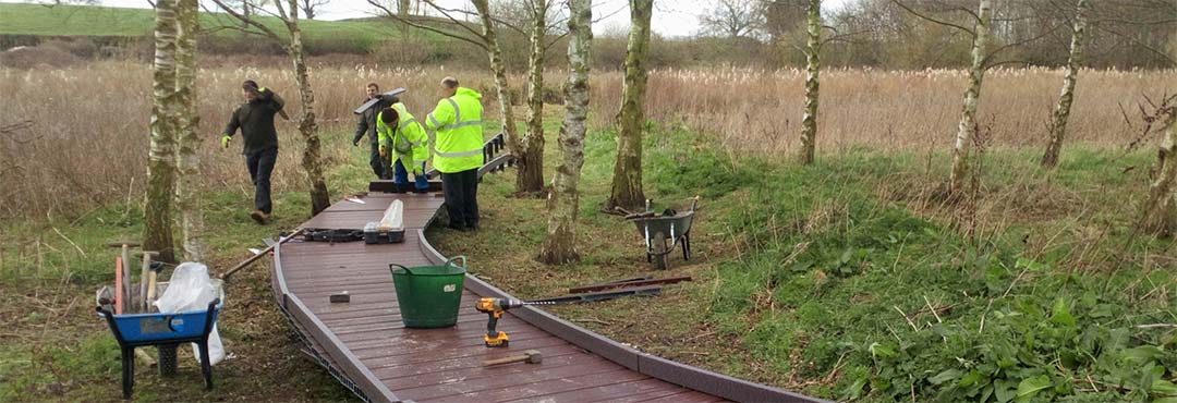 TCV team building a boardwalk from recycled plastic