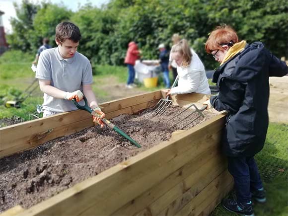 Children working in a garden