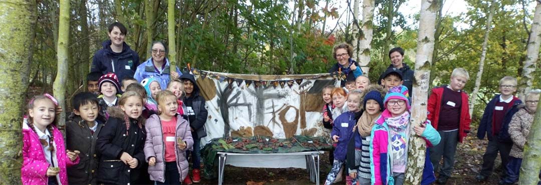 Children having fun in a woodland setting