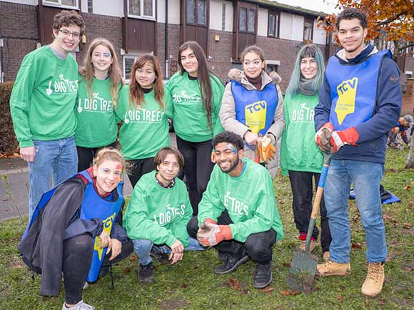 Young people at a tree planting event for I Dig Trees