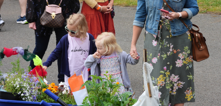 Children viewing TCV wheelbarrows at BBC Gardeners’ World Live