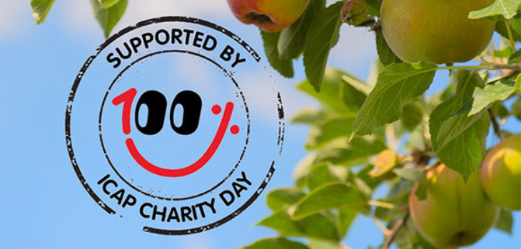 close-up image of an apple tree branch in front of blue sky. next to the branch is the ICAP Charity Day logo