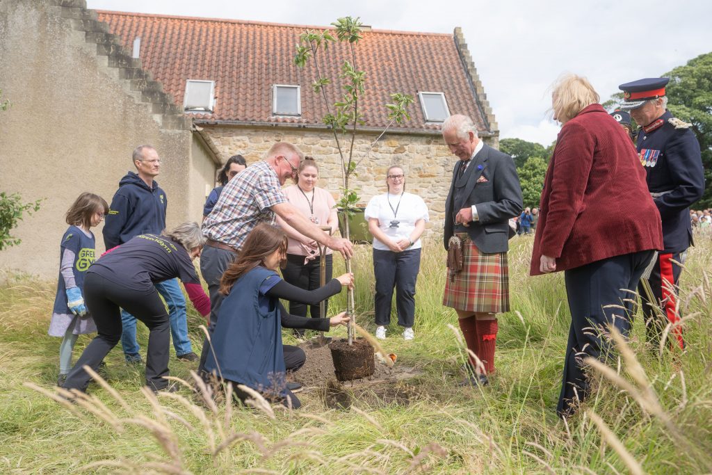 King Charles III plants a tree with TCV volunteers at Kinneil House and Estate