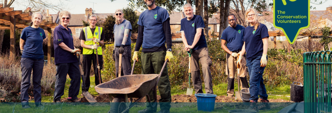 Group of volunteers with a wheelbarrow