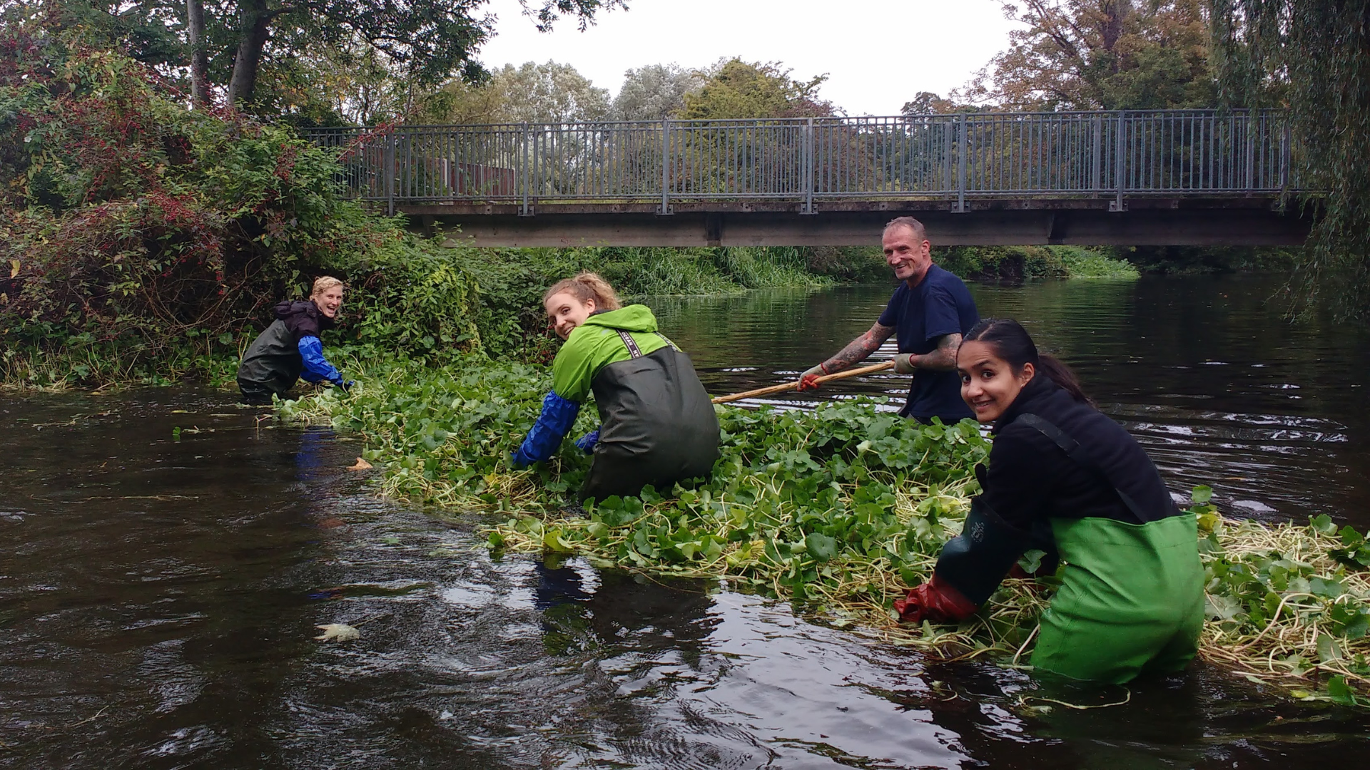 A group of people clearing a river