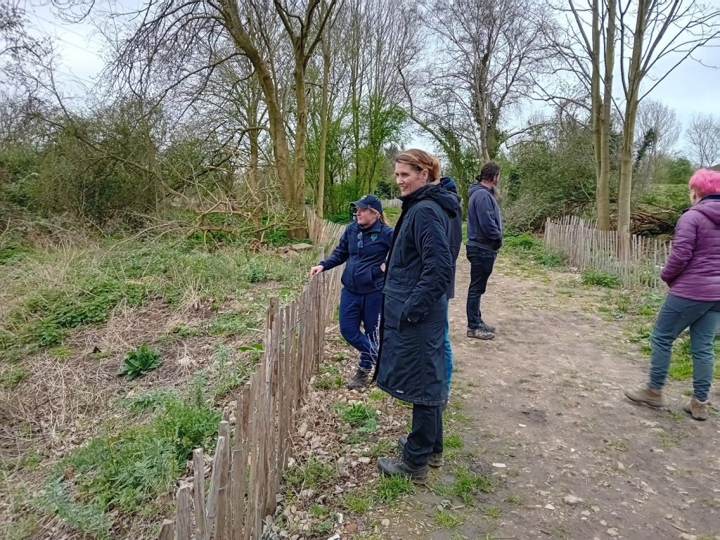 Group people including Rebecca Kennelly in woodland setting