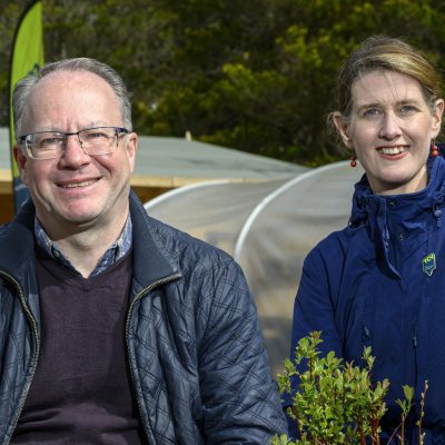 Rebecca Kennelly and Michael Duncan holding tree saplings