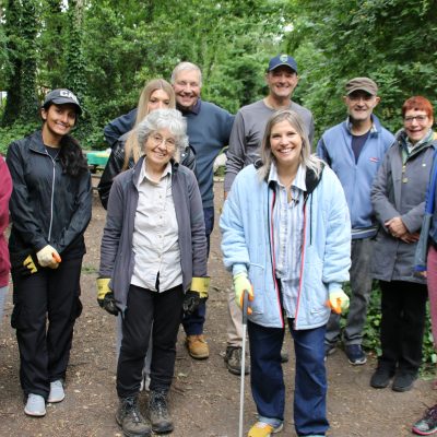 Pips Taylor and volunteers licking picking at TCV Railway Fields