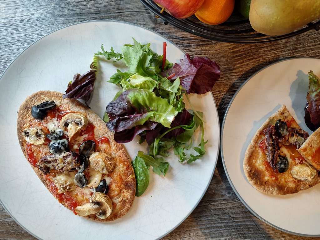 Homemade Pitta Pizzas with salad.
