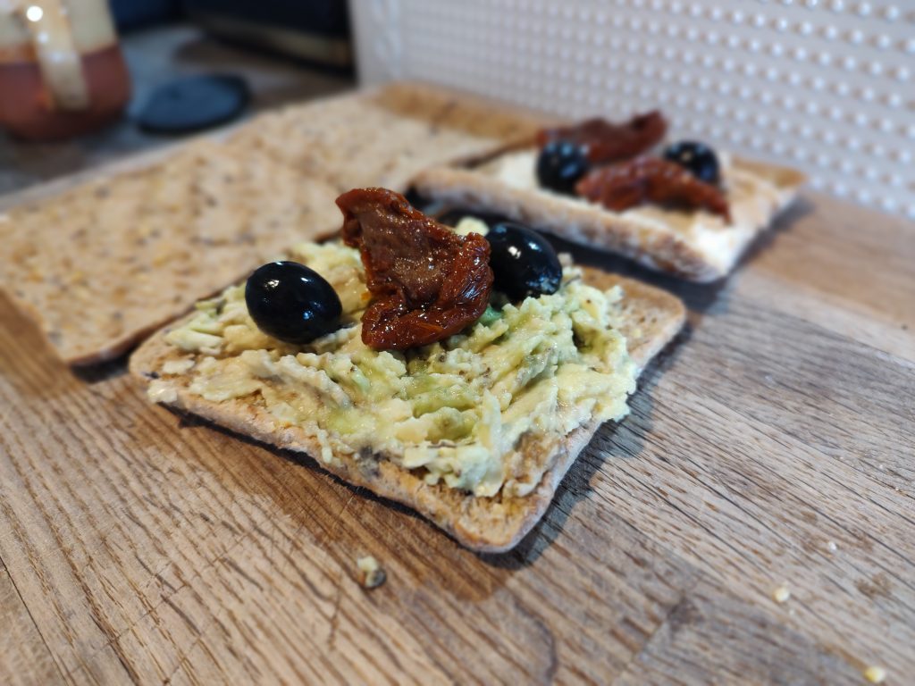 Smashed Avocado on Toast with sundried tomatoes and olives