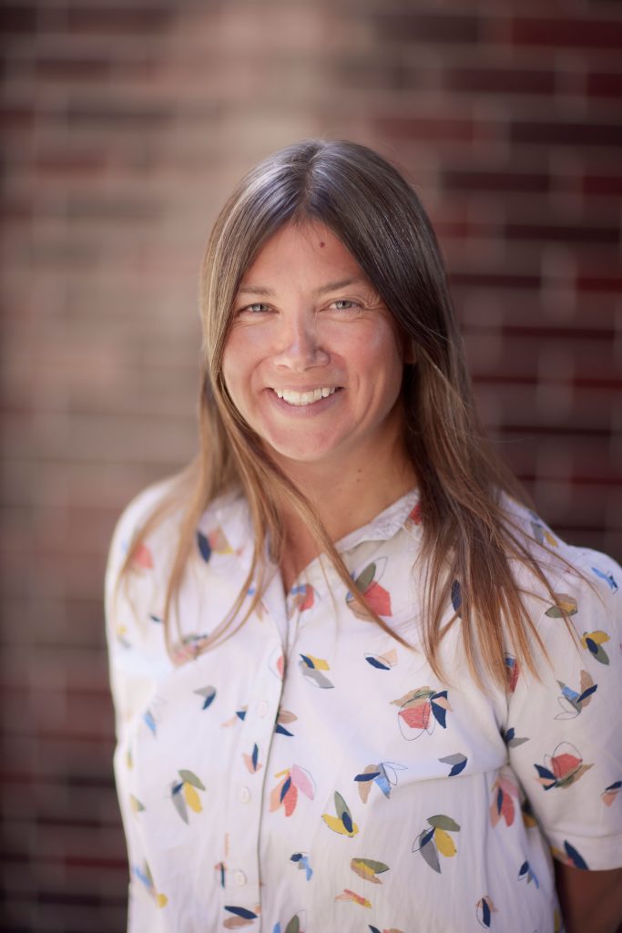 Rachel Slade, Director of UK Operations at TCV.
Female smiling at the camera with long brown hair.