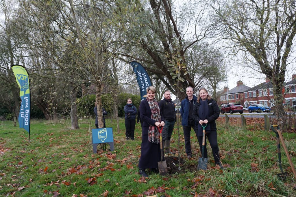 Emma Hardy MP visits TCV - group shot of people holding spades next to a newly planted tree