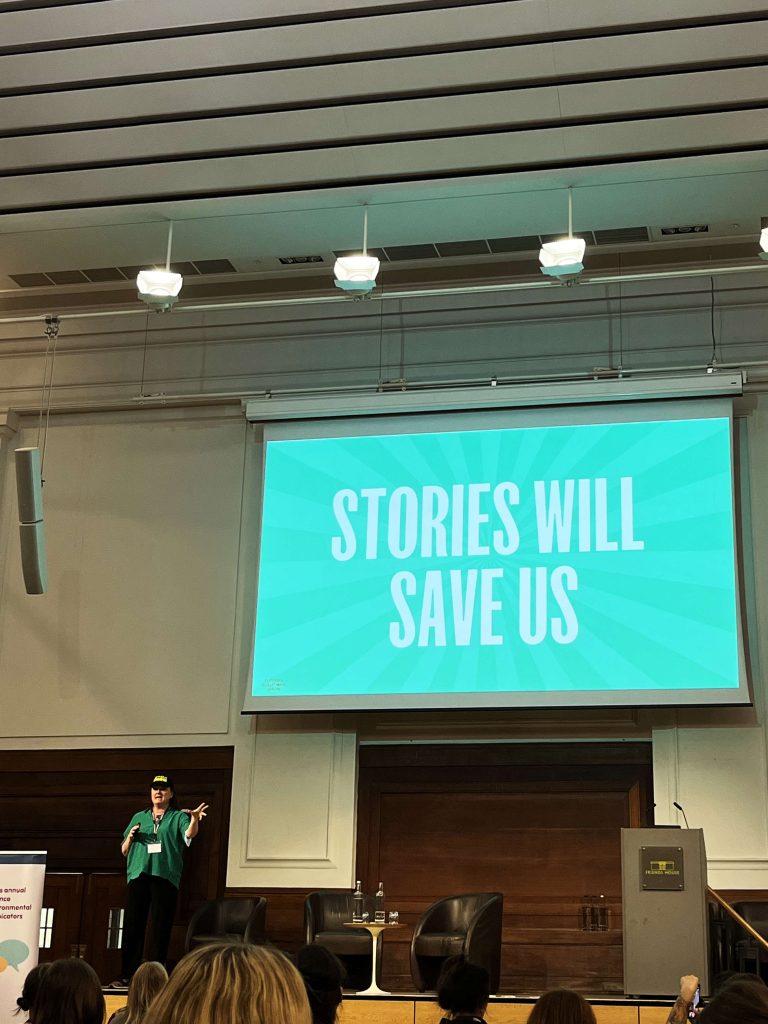 Presentation slide from a conference saying Stories will save us.