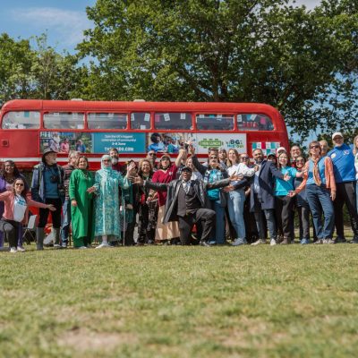 Ainsley Harriot with volunteers on a bus for The Big Help Out