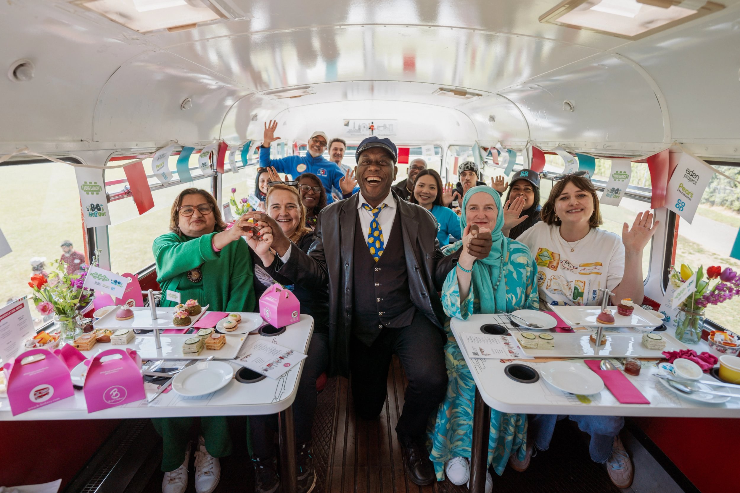 Ainsley Harriot with volunteers on a bus for The Big Help Out