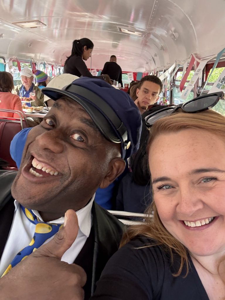 Ainsley Harriot with volunteer, Shona, on a bus for The Big Help Out
